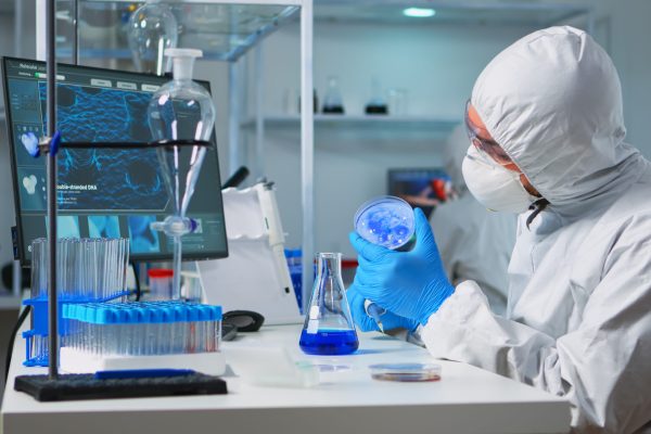 Chemist in ppe suit using micropipette for filling test tubes in modern equipped laboratory. Team of scientists examining virus evolution using high tech for vaccine development against covid19 SSUCv3H4sIAAAAAAAACpRVy47cNhC8B8g/LHQOETbfyhfk4pOPQQ4UyZkhLIkDPewYi/33tDSShtLKaxiYw7Cr2GxWs0uvv//28lJUto+u+OvldVrhOtb12A+dHWJqMUz/WOJdaH3o8sjXjiuaB4KPQ+qirfNgZQd3a20TMNiOdT2F32aw6Ac7jH3os9PvtzQkP7YTm68pmui61A/JfbljbYjAhmB43rKL+i7Yph/ifCbTaxgY7y67SBWvj7RTivxEl+o0dlX6L0/b38ZhCN28Y5fGh3vq47OQJ3JPrZe7iK1t830f8akK75M62+5qeyJNmnoT6tCEdujzssP3EJqp5ExkZ4dwxa7sZF6b/s9j/bICy8kDQsXfwdbDzdku/PkJO+uwrcs5DzXGamJ9ir0LdW3bkLA1K/44+weJP7sYWhd+Idvjz7+bYlfcP4n4+pZdtENF7OM1LdcqlBdSQ2kIc5YTQRklptSeWK6B+YpZ8Je1jMJzqi0NmtDgL0RUjBFjGCdMOx+MdFQxtZEZNVaBVQSAKSKE0sRQLQituAdnJNhSzfU/ii6+fMOX08wtWMq1o48pa8nXhArP3czudO+ii+0125aG2zyF6zaXxnboJjGKrbg6pbut6un1XzBnWOM32/dI92s8fyU486nJzmnTMEu5ZC08PqNpCZwpClBKZUrFhGRQ5MN8i5hnLmctcLzXyfowHbq9hZOJViApoN6rb7wb7plQglnH8TjnC0Eb8SSsE3+GHWf/jLOzgRP84AhnlKM3nHFWlzjDVr84xXLnWAgllVn9Bw+ZOYxSlnHeuclEAgqaZ63YjAUxhTPFzQNa53ya3yaiFvs2524OihrNlAD1E3EYdo3+oIcH7LSHDLj88JEcCDv1GQgNHynMQJbsp+oxlZPyHjLNpdYft0gopalYFN59L5EYfW7kRwULISWjQPXTqlYBUQl7Tb3D66IkDCin+NMb7yhmIdDbWFmqZyqfa1lgM1AsA2LDVykLEKVRimmzQTslMbURBrRiG/5OyAIU11KUi79kMhZQ+sAC2vrFayCCc0pKCRUpPQ8BLtW24yhuUVKuNAiYrXlRNU5vttDUBnDBEOMlfip4eSE2SEa01N5aE5i8MNz19j8AAAD//wMAKDaUrjUJAAA=
